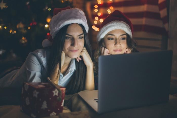 two-women-watching-movie-during-corporate-holiday-party