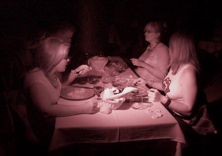 diners eating in the dark at Opaque Restaurant