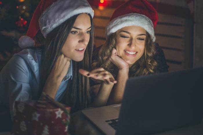 two-women-watching-holiday-movie-at-virtual-corporate-holiday-party