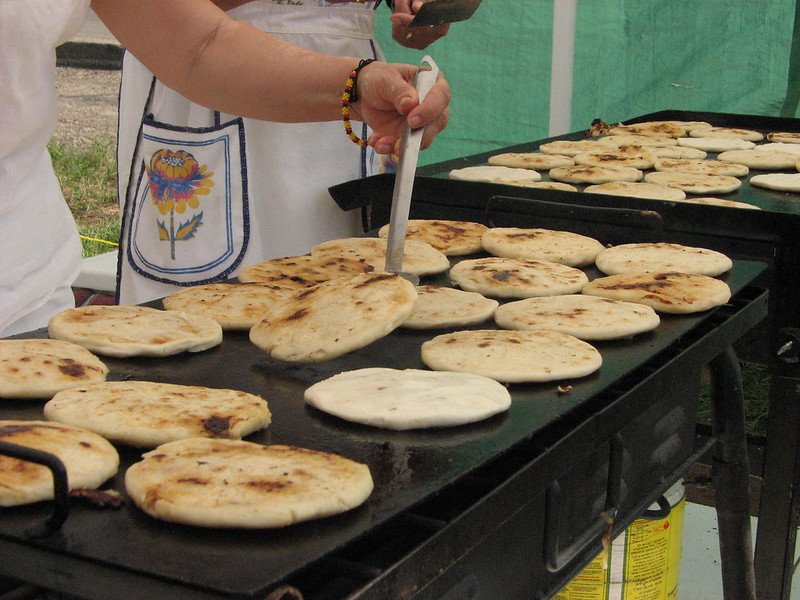 woman making pupusas in best places to eat in los angeles cheap
