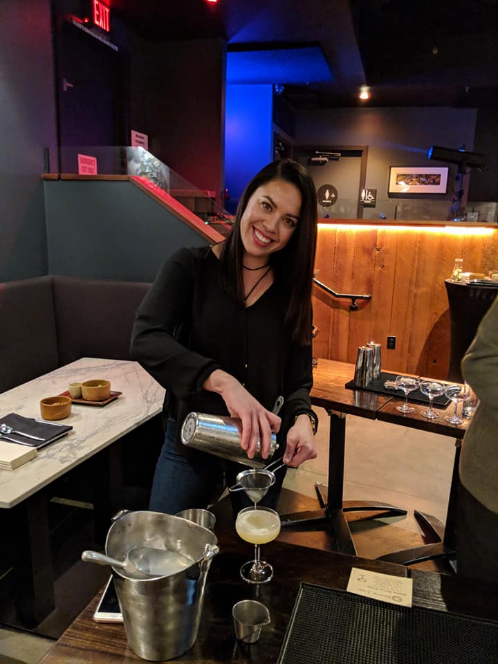 straining cocktail on a hands on culinary activities in nyc food tour