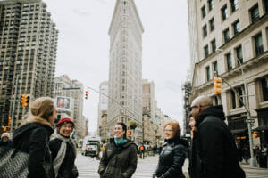 Group of people on food tour in front of Flatiron Building