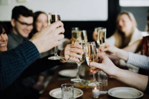 cheersing with champagne on a NYC private food tours