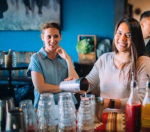 woman taking cocktail class at southwestern restaurant during bachelorette party food tours